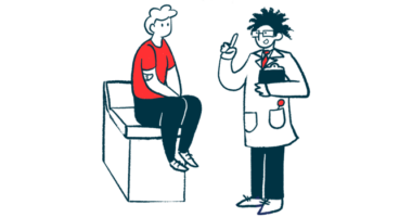 A doctor speaks with a patient who is sitting on an examination table.
