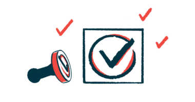 A rubber stamp rests on its side beside an impression of a check mark.