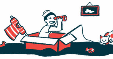 A child pretends to be a sailor, using a box as a ship and a shirt as a mast, while a cat plays with a toy fish.