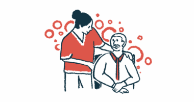 A healthcare professional speaks to a man in a wheelchair.