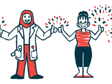 A clinician in a white lab coat with a red head scarf stands next to a person with a red shirt and black pants, both making the thumbs up gesture, with fireworks in the background.